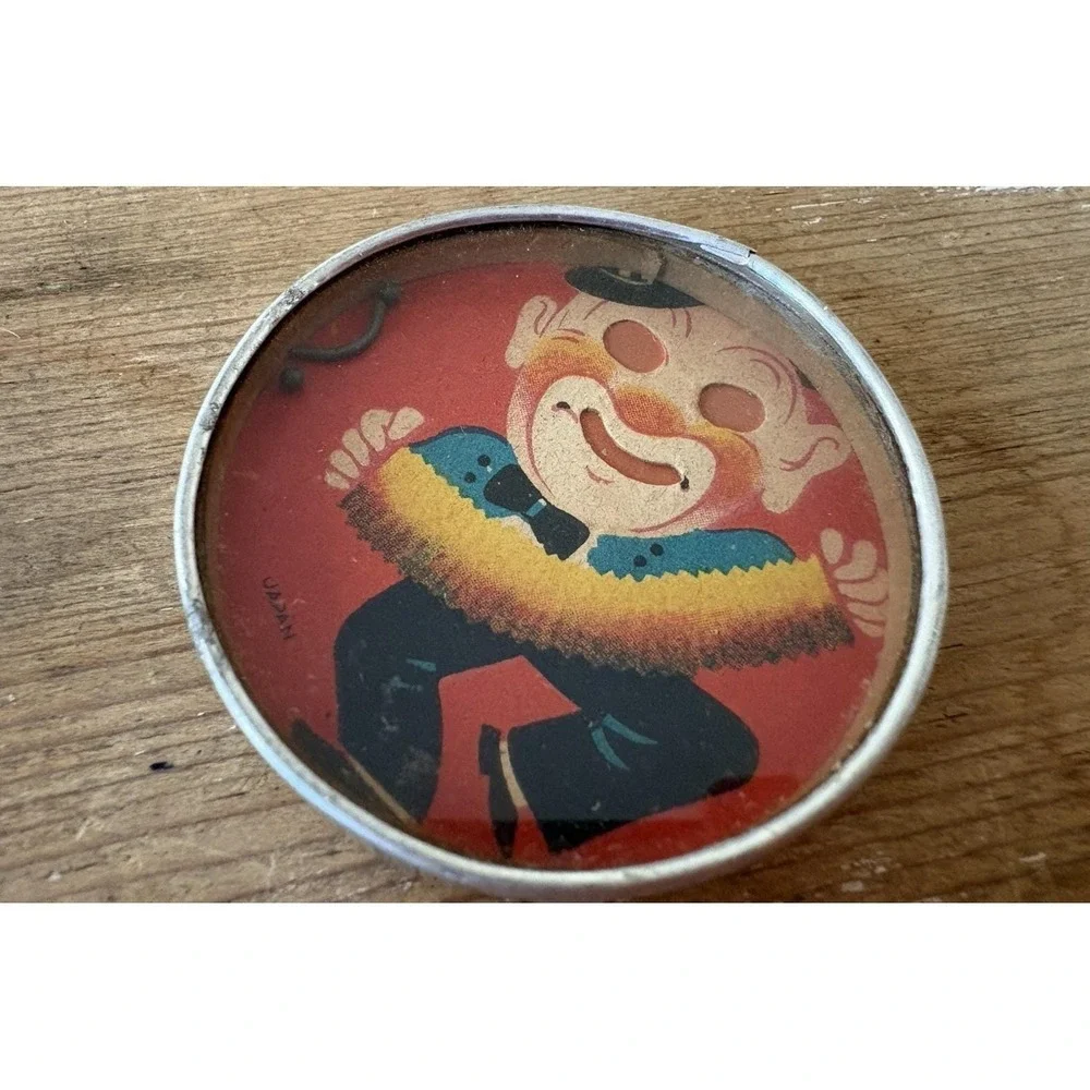 Vintage hand held dexterity puzzle clown playing accordian mirror back Japan 2